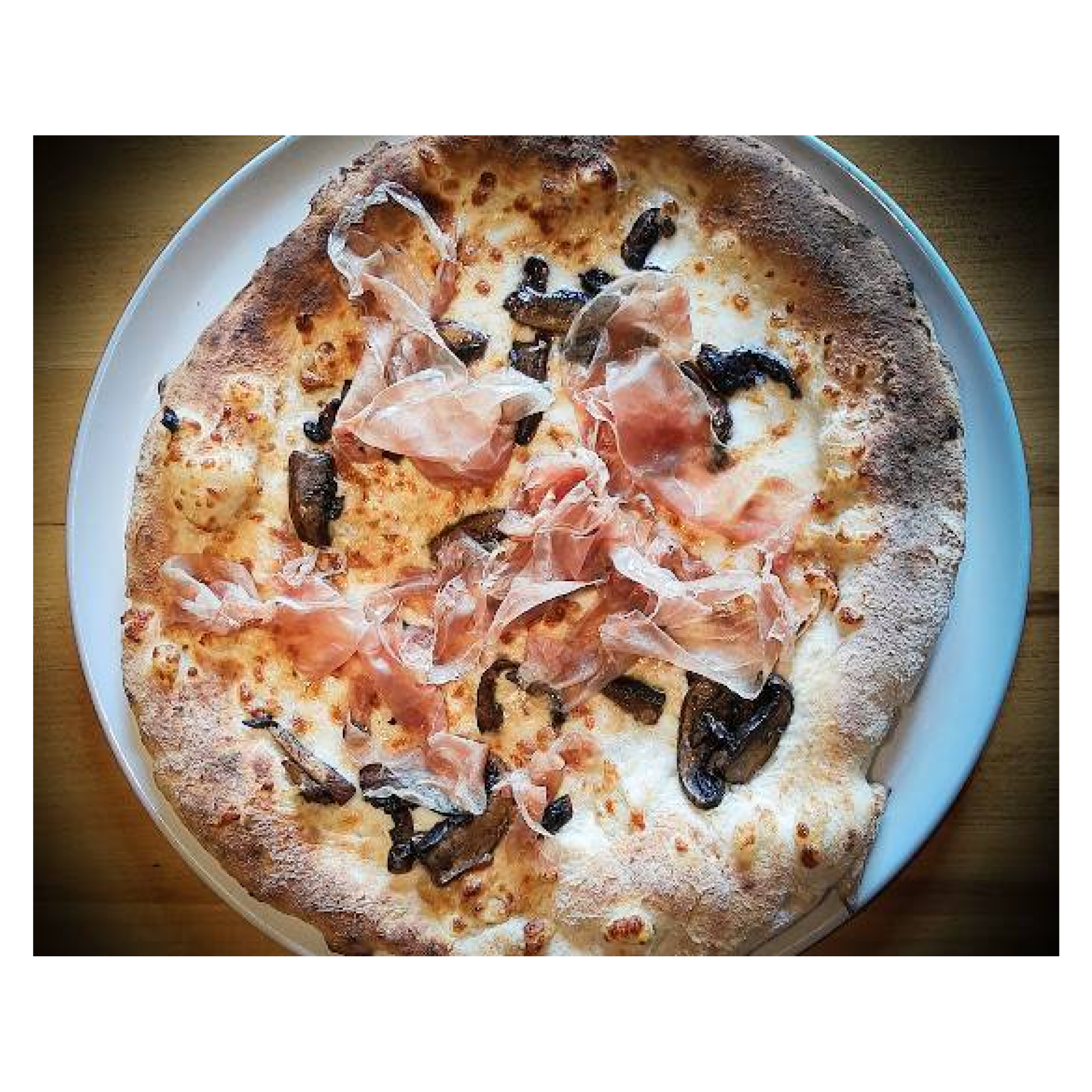 Pizza de portobello prosciutto y ajo quemado